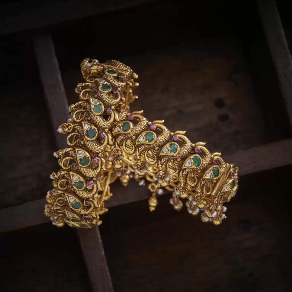 Gold Bangle with Peacock Design